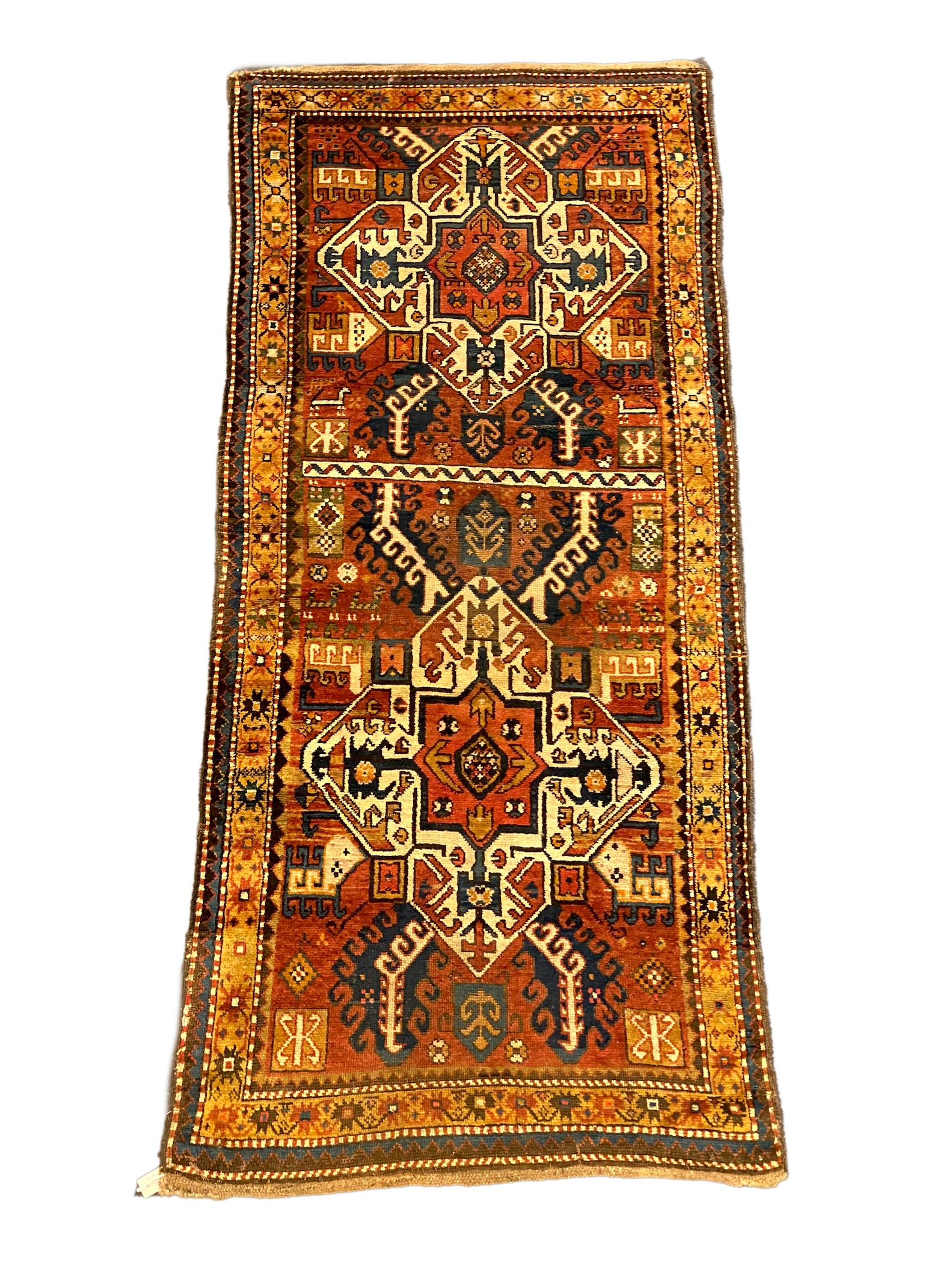 A Kazak red ground rug, 240 x 108cm